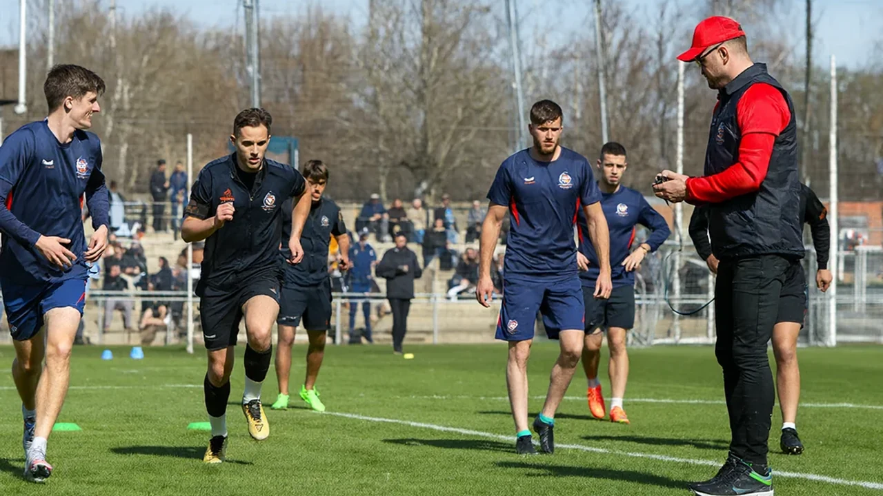 Coach timing players during a shuttle-run fitness test